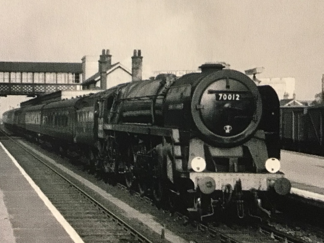 Alex Coomber on Train Siding: A Norwich Sheds immaculate Britannia 4-6-2 No. 70012 John of Gaunt arrives at Witham Station with the 13:45PM from Norwich to
London...