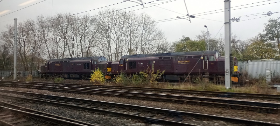 Hardley Distant on Train Siding: CURRENT: West Coast Railways 37685 (Left) and 37668 (Right) are seen stabled in Carlisle High Wapping Sidings today between
duties.