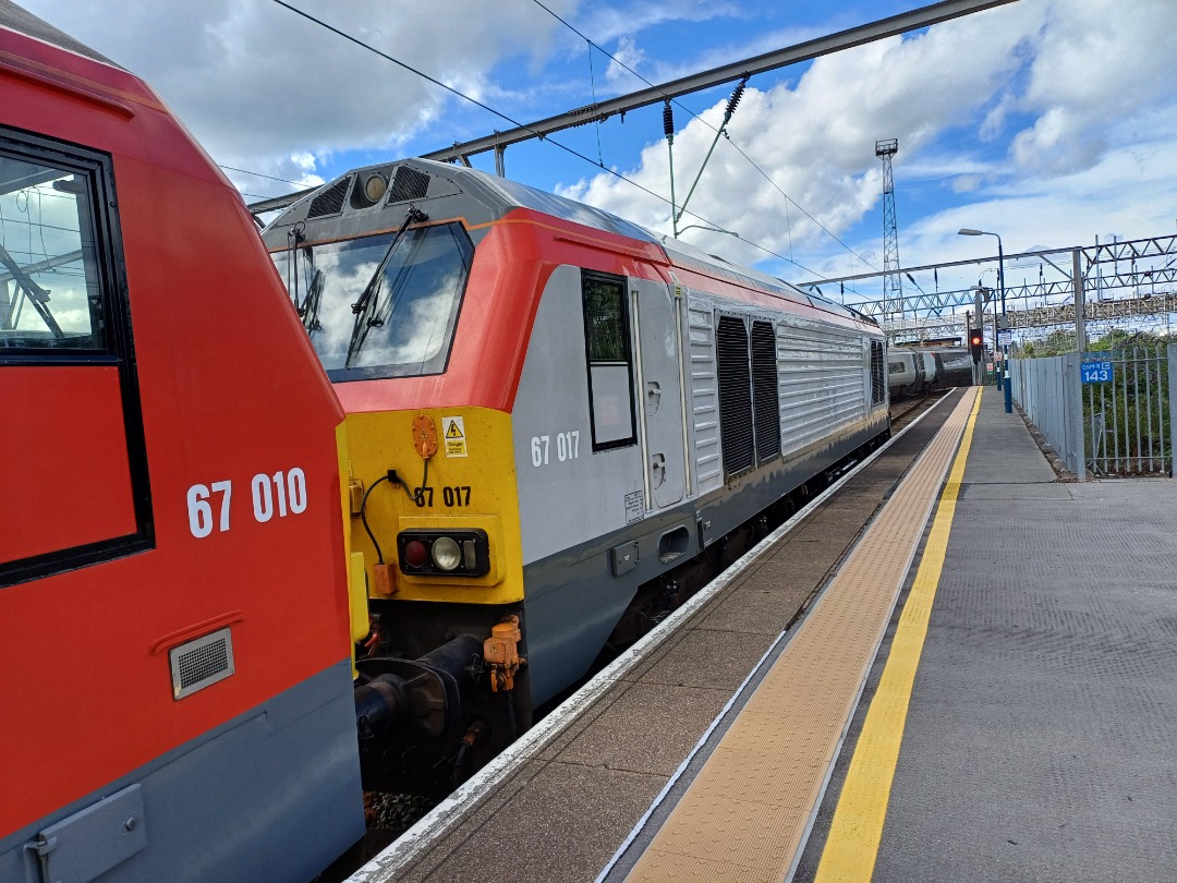 James Taylor on Train Siding: 2 class 67 at crewe Station 67010 and 67017 one in DB red and one in grey and red in transport for Wales livery