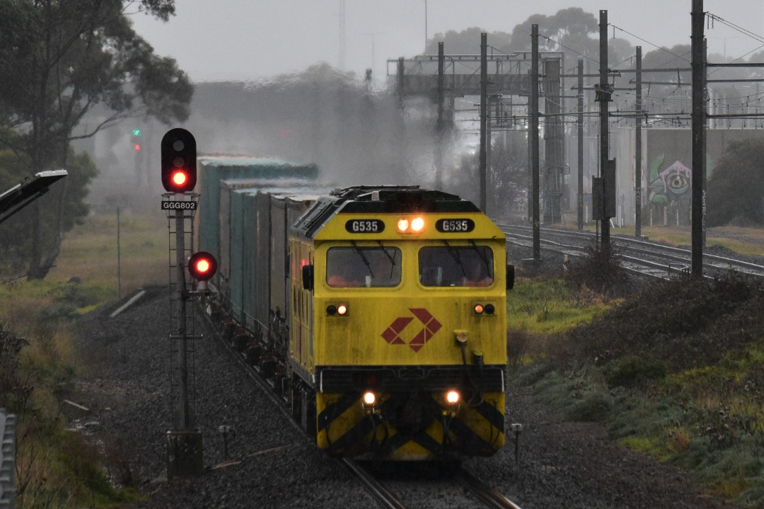 Shawn Stutsel on Train Siding: In wet, cold weather conditions, Aurizon's G535 races through Williams Landing, Melbourne, with the second half of 3MP1
heading for...