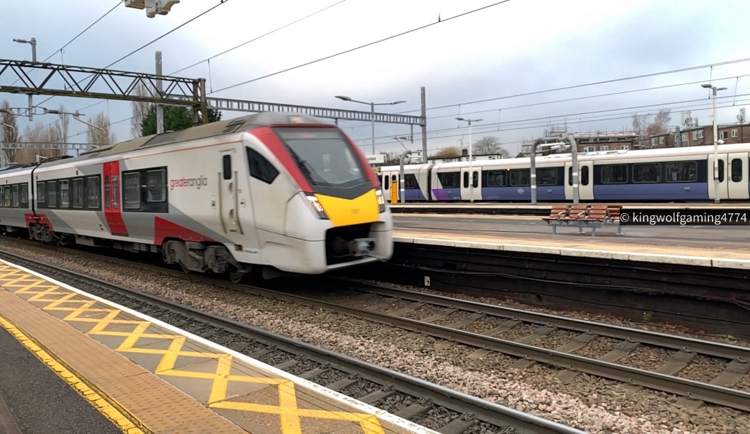 KWG4774 on Train Siding: Greater Anglia London Liverpool Street to Norwich Passing Shenfield, Essex. With the Elizabeth Line in the background.