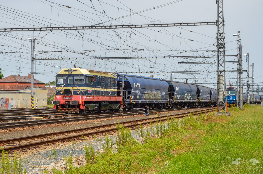 Adam L. on Train Siding: An 721 Class "Hektor" Diesel Switcher, operated by a local factory at the nearby town of Znojmo departs the Břeclav station
limits with an...