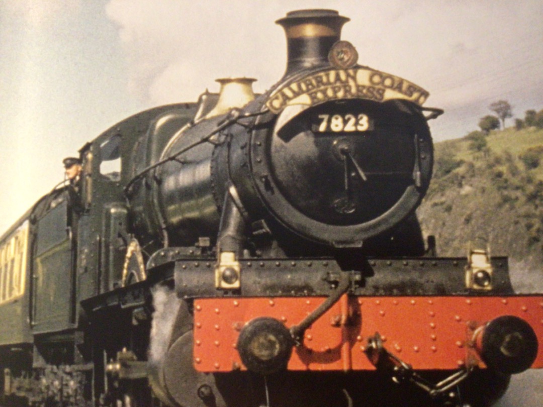 Alex Coomber on Train Siding: In the glorious sunshine and complete with a headboard. A Manor Class 4-6-0 No. 7823 Hook Norton Manor leaves Machynlleth with the
down...