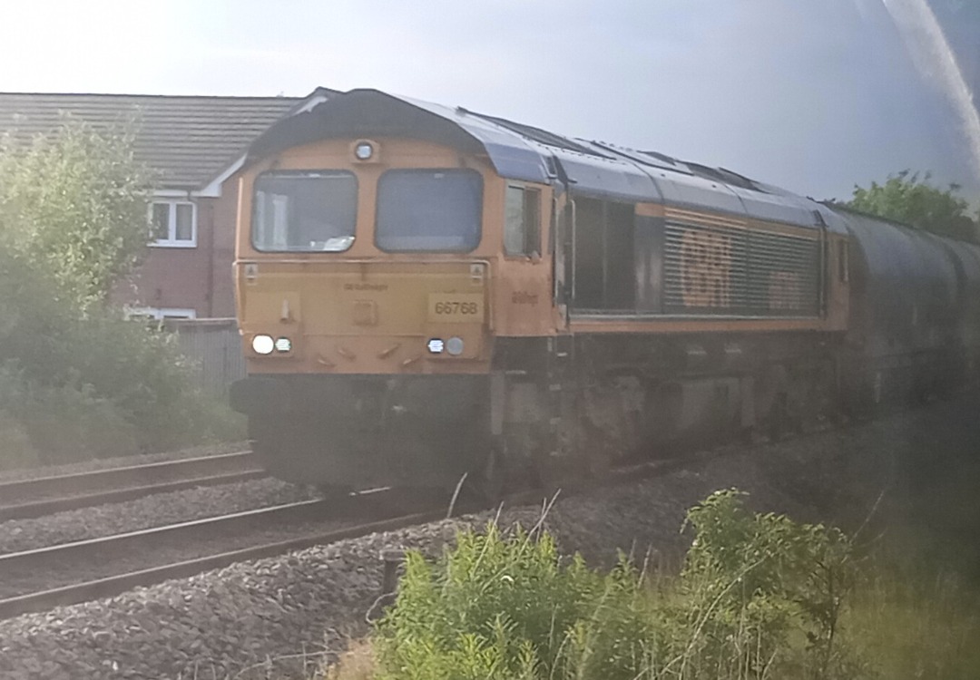 Hardley Distant on Train Siding: CURRENT: 66768 approaches Wrexham General Station today with the 6V41 17:07 Penyffordd Cement to Avonmouth Hanson Siding loaded
Cement...