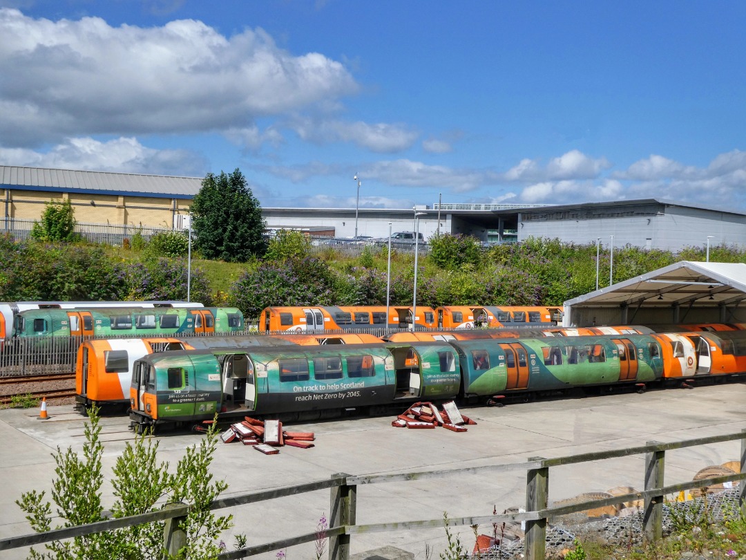 The Jamster on Train Siding: Met Cam Glasgow Subway cars 125 and a unidentified trailer get their seats ripped out prior to what I assume will see them get
scrapped....