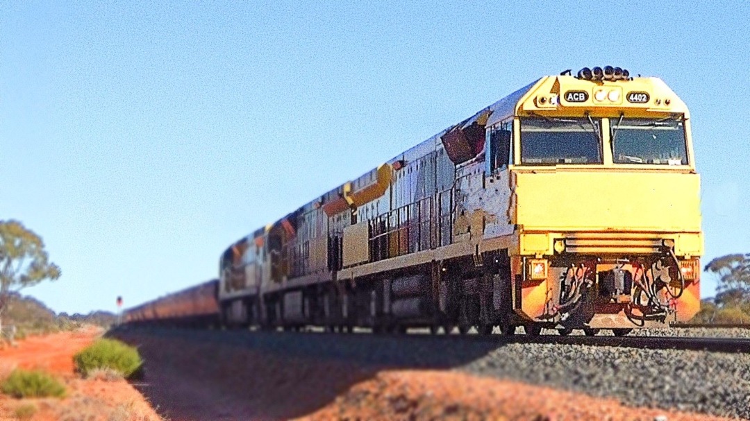 Gus Risbey on Train Siding: Aurizon Owned C44ACi units, ACB4402, ACC6031 and AC4303 lead a loaded and heavy iron ore train bound for export at Esperance,
sighted at...