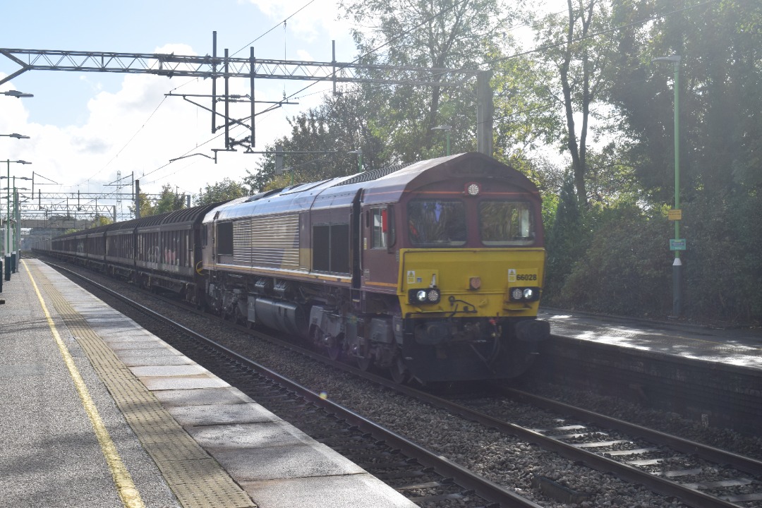 Hardley Distant on Train Siding: CURRENT: 66028 passes through Acton Bridge Station today with the 6M13 01:04 Dollands Moor to Sutton Foundry service.