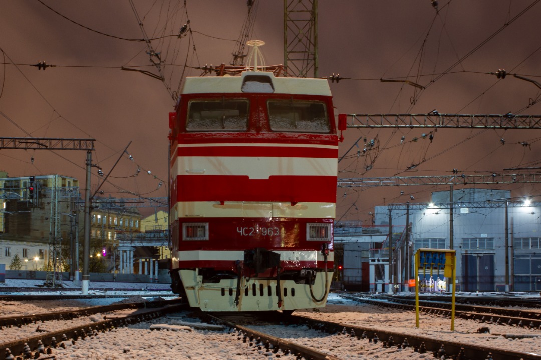 CHS200-011 on Train Siding: It still smells like paint. Electric locomotive ChS2T-963 in the St. Petersburg passenger Moscow depot prepared for installation as
a...