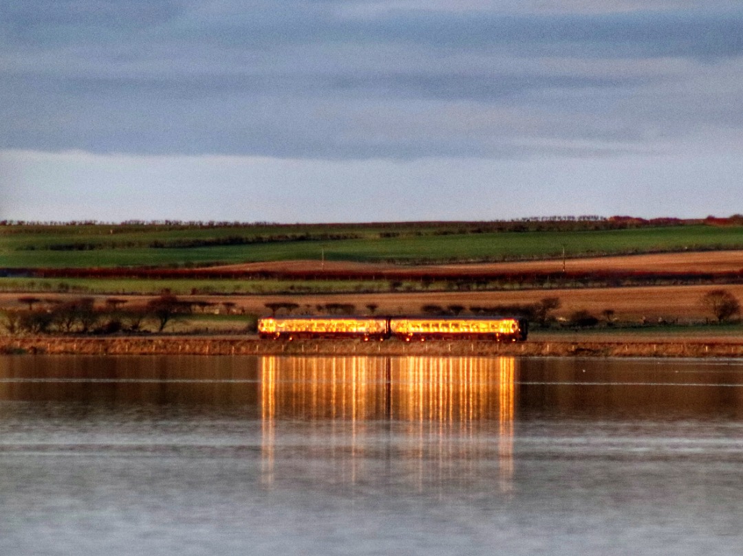 The Jamster on Train Siding: Scotrail 158712 catches the sunset as it passes Loch Watten nearing journeys end with 2H63 1041 Inverness to Wick. 16/12/21