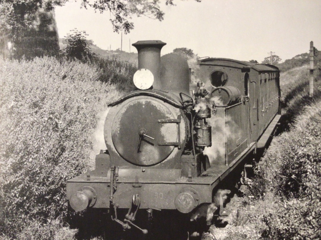 Alex Coomber on Train Siding: The end is nigh. A Class 02 0-4-4T No. 30 Sherwell trundles along the weed infested approach to the 3 quarter mile tunnel under
Boniface...