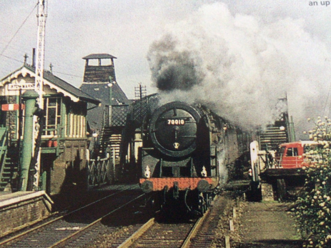 Alex Coomber on Train Siding: A Britannia Class 7MT 4-6-2 No. 70010 Owen Glendower at full throttle as it thunders towards Stowmarket Station over Stowupland
Road...