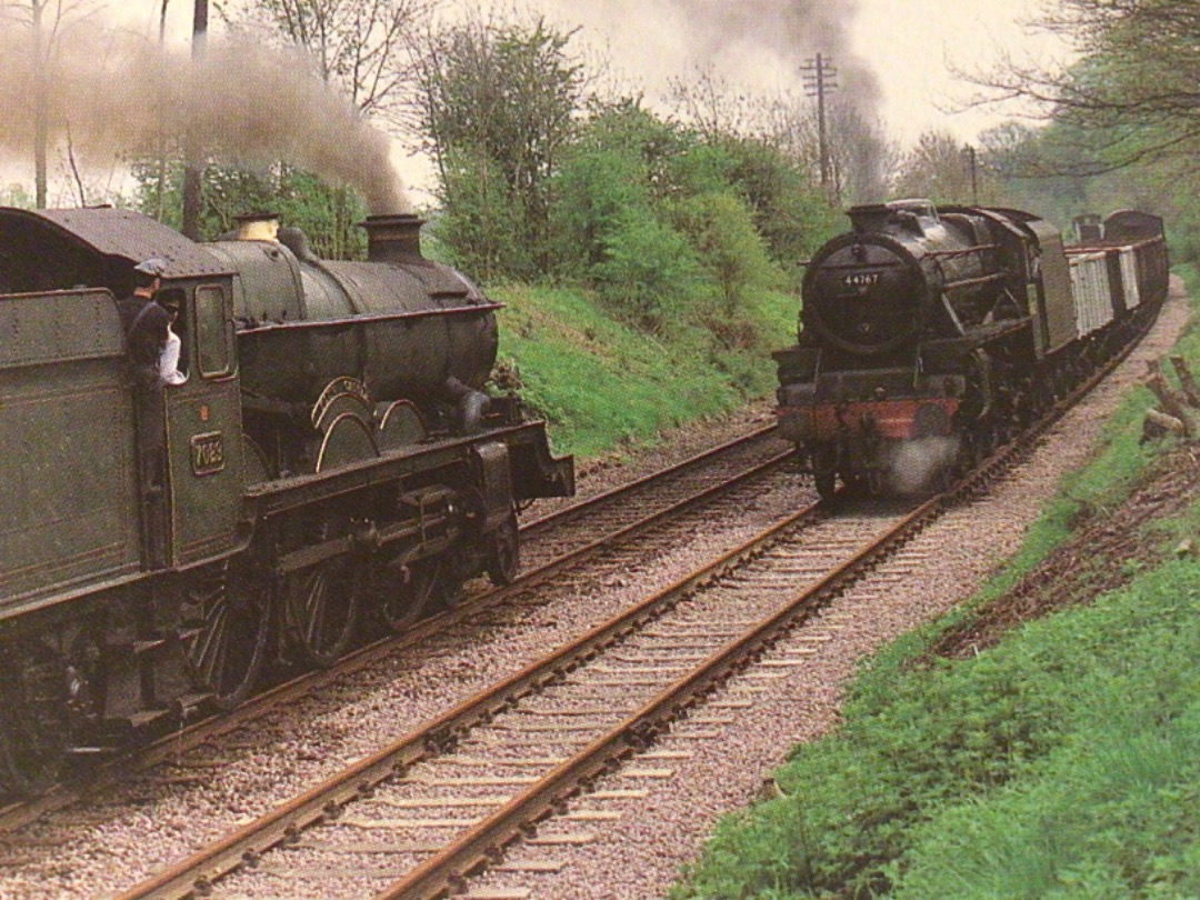 Alex Coomber on Train Siding: A GWR No.7029 Clun Castle heads an up express as No. 44767 toils slowly northbound on a down mixed freight near Swithland in April
1994.