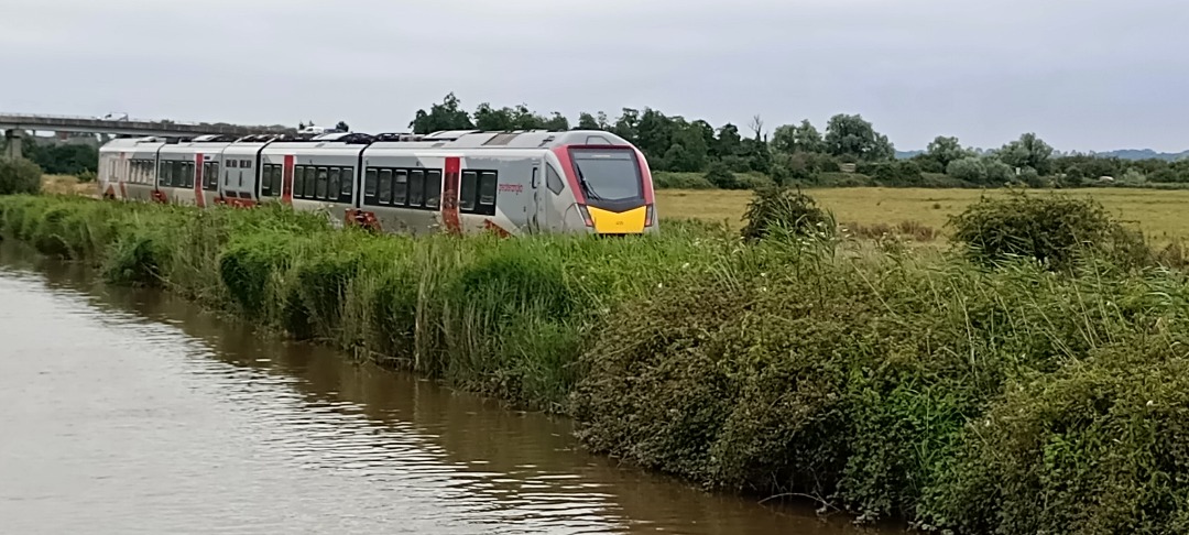 Hardley Distant on Train Siding: CURRENT: 755415 (Both Photos) travels alongside the River at the Haddiscoe New Cut on Thursday 25th July 2024 with the 2J74
12:05...