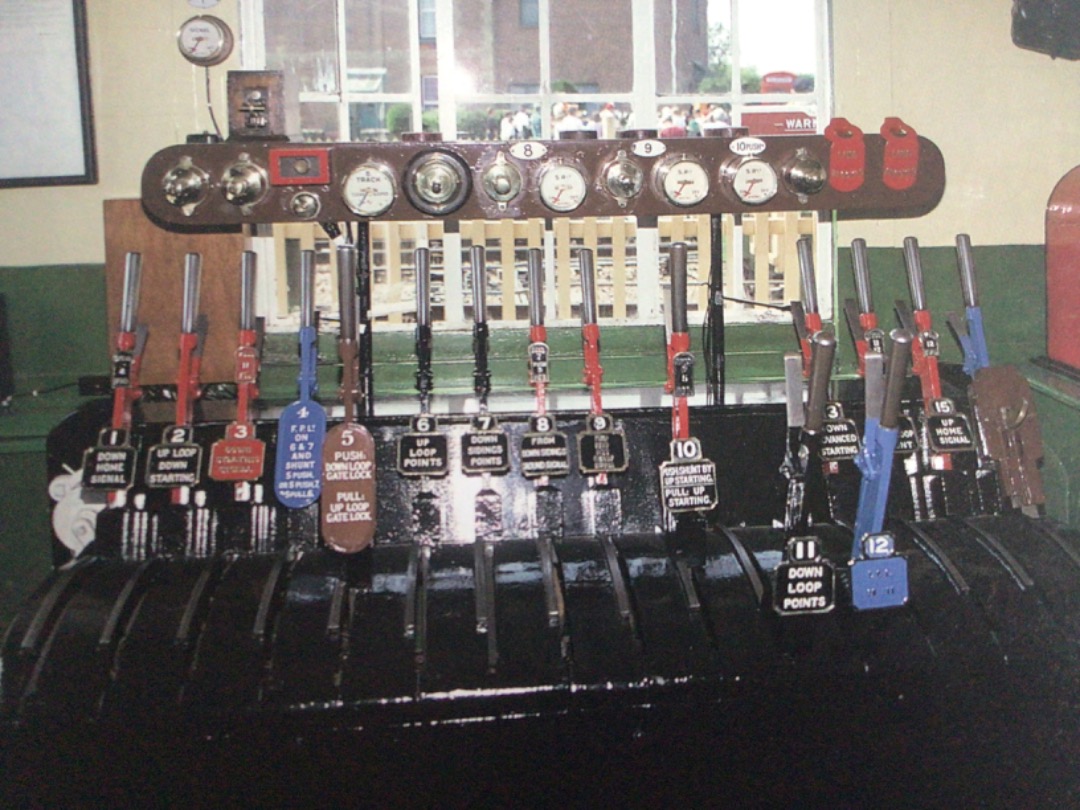 Alex Coomber on Train Siding: The interior of Haven Street Signal Box with its 16 lever knee high frame. Brass signal repeaters to confirm the position of the
signal...