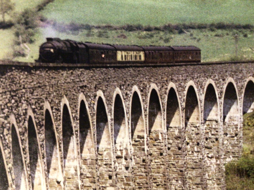 Alex Coomber on Train Siding: Alan Jarviss precarious position 100ft up at the southern end of the curving 18 arch Cynghordy Viaduct is rewarded with this shot
of a...