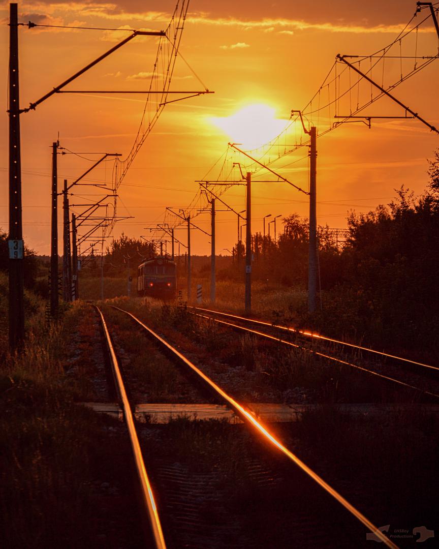 Adam L. on Train Siding: PKP Cargo ET41 Class electric, numbered 002 is captured heading into the sunset as it heads west to Rykoszyn in order to pick up a
loaded rock...