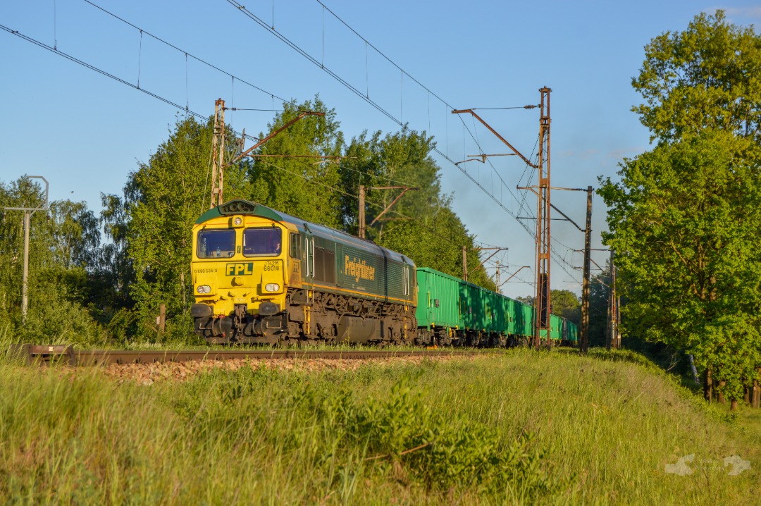 Adam L. on Train Siding: A FreightlinerPL Class 66, numbered 018 is seen departing the Sitkówka-Nowiny Yard limits as it heads north towards Kielce with
a loaded rock...