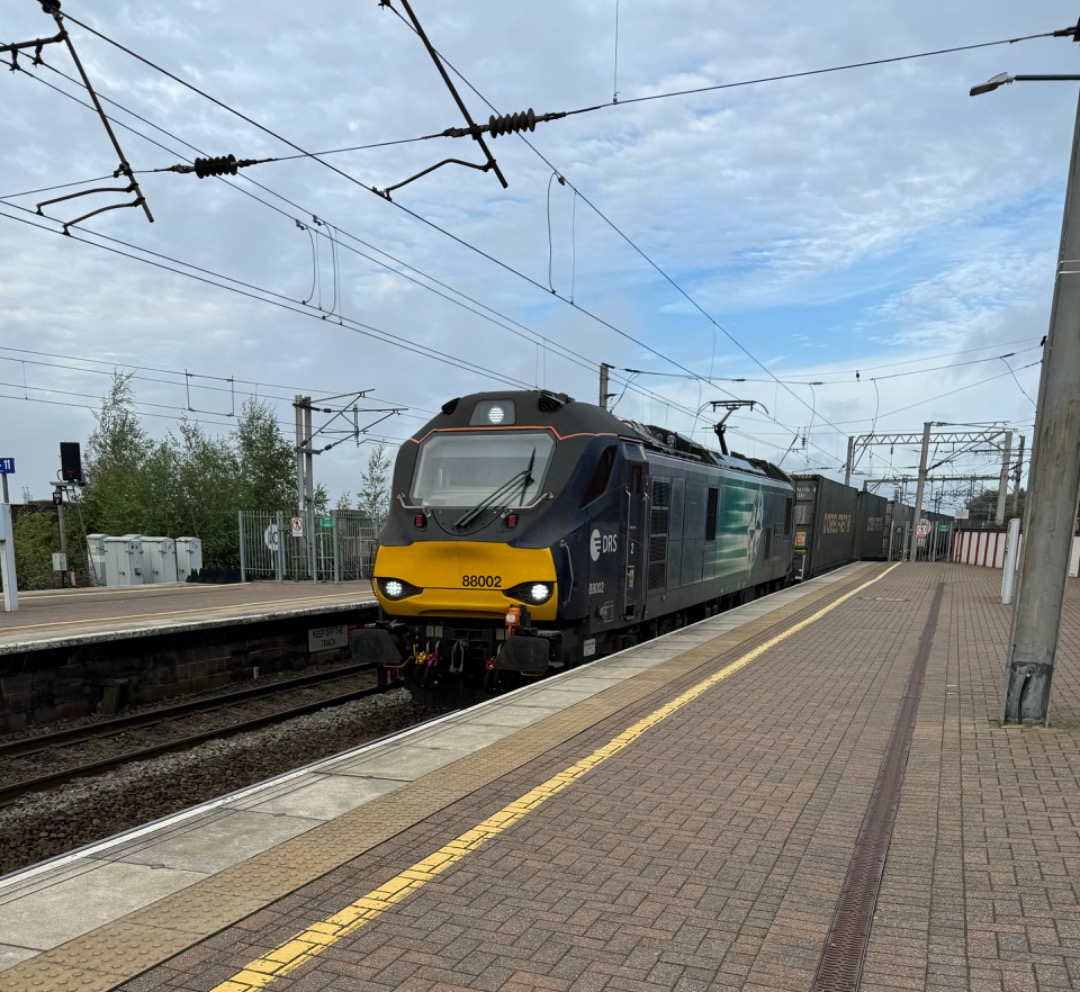 k unsworth on Train Siding: 88 002 Prometheus storms through Wigan North Western this morning....Fun fact - Prometheus was the first Class 88 to be delivered to
the UK...