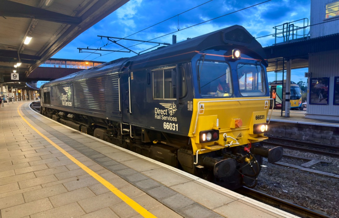 Michael Gates on Train Siding: DRS Class 66, 66031 awaiting a signal to proceed as dusk falls at York station this evening.