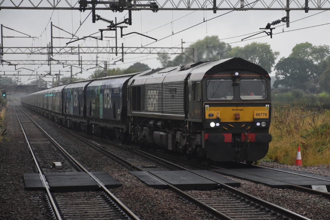 Inter City Railway Society on Train Siding: 66779 EVENING STAR on 6E10 LIVERPOOL BIOMASS - DRAX, passing Acton Bridge on a very wet