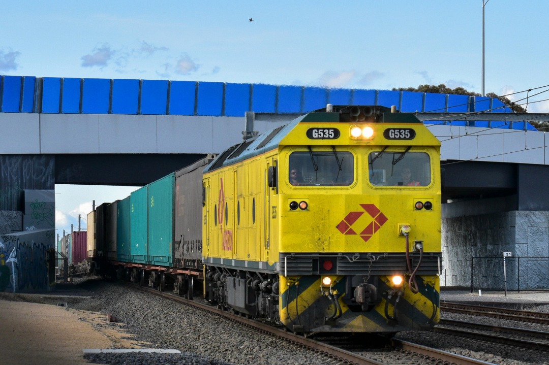 Shawn Stutsel on Train Siding: Aurizon's G535 races under the Tarniet Rd overpass, Werribee, Melbourne with the second half of 3MP1, Intermodal Service
bound for...