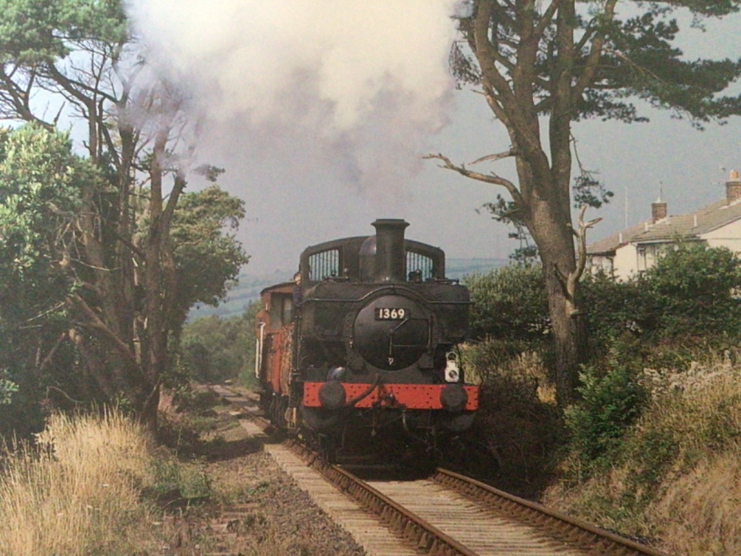 Alex Coomber on Train Siding: A freight train hauled by 0-6-0 Pannier Tank No. 1369 which was introduced in 1934 is seen here making its way from Boscarne
Junction to...