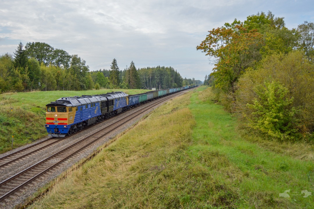 Adam L. on Train Siding: 2TE116 Class, numbered 1654 owned by a Latvian private freight carrier - Baltijas Ekspresis is captured in shot glimbing the grade
towards...