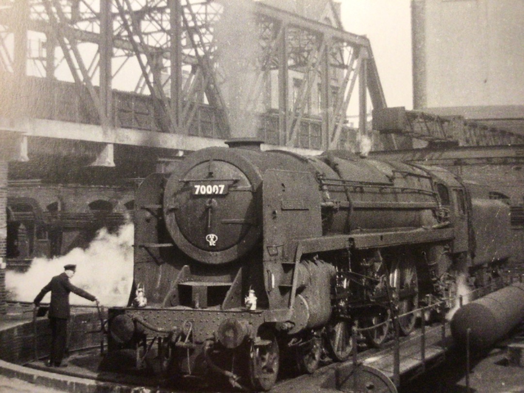 Alex Coomber on Train Siding: A BR Standard 7MT Britannia Class 4-6-2 No. 70007 Coeur de lion. A 32A Norwich engine is being turned at London Liverpool Street
ready...