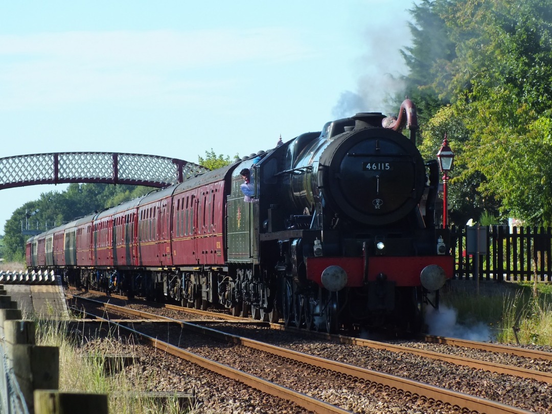 Whistlestopper on Train Siding: In the late summer sunshine, LMS Royal Scot Class No. #46115 "Scots Guardsman" called at Appleby for water this
afternoon working the...