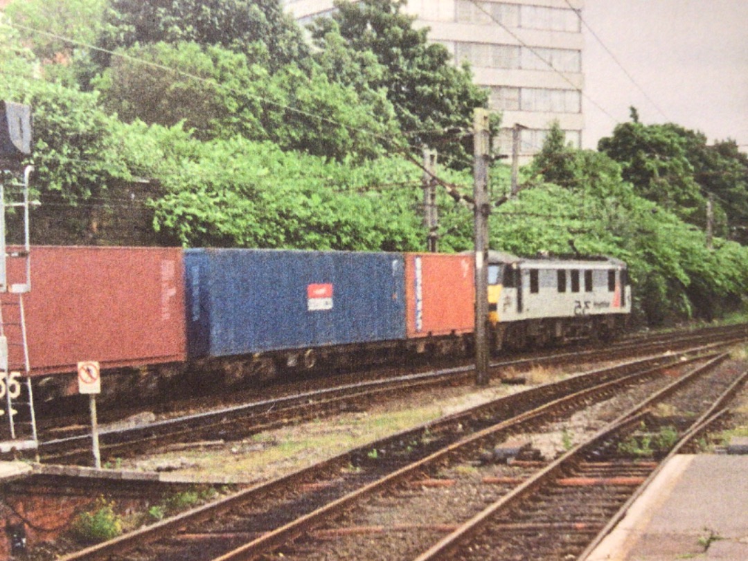 Alex Coomber on Train Siding: A Class 90. No. 90048 still sports the 2 tone grey and red flash livery as she sets off south from Preston with the 4L60 from
Coatbridge...