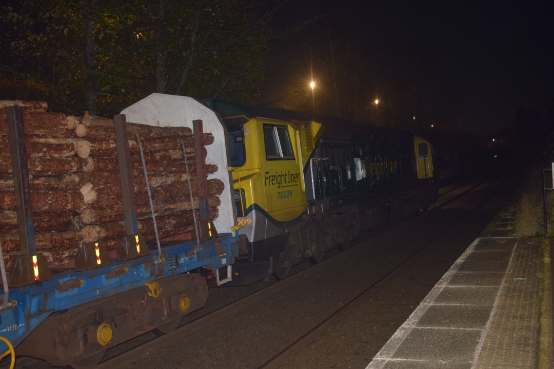 Hardley Distant on Train Siding: CURRENT: 70009 on hire from Freightliner to Colas Rail is seen at Chirk Station today arriving (Photo 1), pausing (Photo 2) and
then...