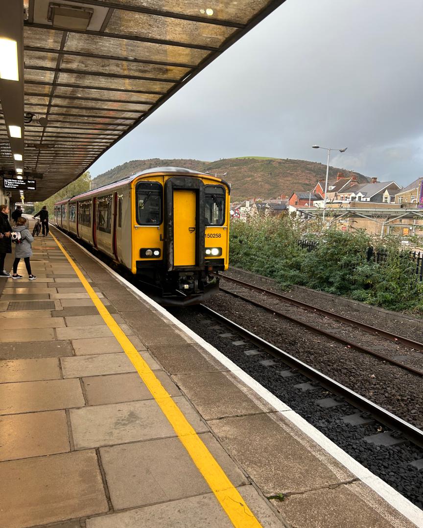 Iain Alba on Train Siding: The 150258, running the Swansea to Chester service, arriving at a cloudy and wet Port Talbot Parkway at 17:32 on 26 October 2023.