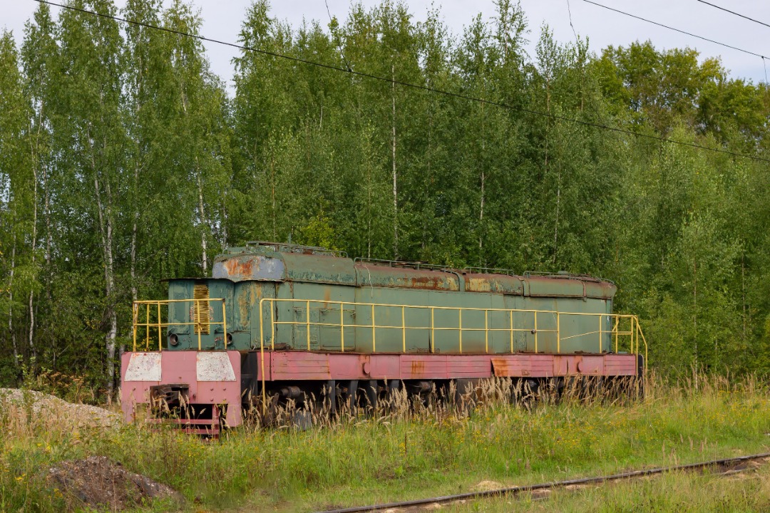 CHS200-011 on Train Siding: a decommissioned shunting diesel locomotive-booster made from a diesel locomotive ChME3-1506 stands inoperative on the territory of
the...