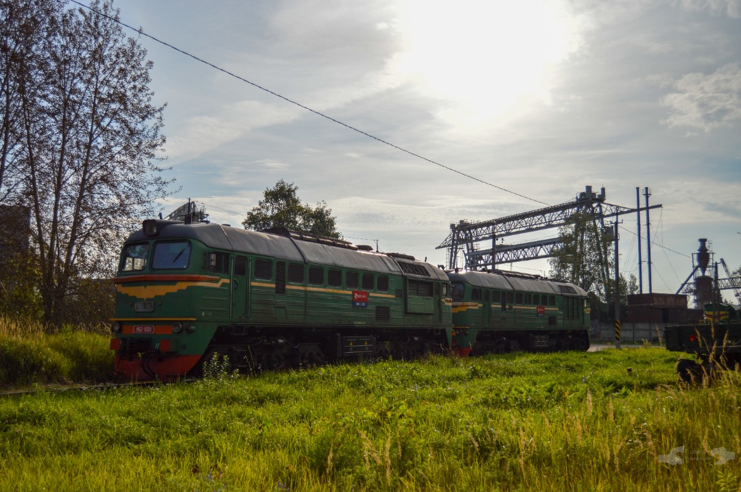 Adam L. on Train Siding: A duet of Latvian M62's numbered 1035 and 1039 are seen offline, catching the early morning rays of sunlight nearby the LDZ Cargo
Offices in...