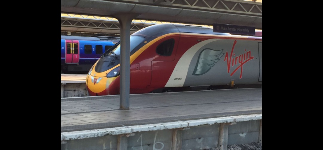 Tom Lonsdale on Train Siding: Another from my archives. 390002 "Virgin Angel" showing off her wings at Manchester Piccadilly before departure for
London Euston.