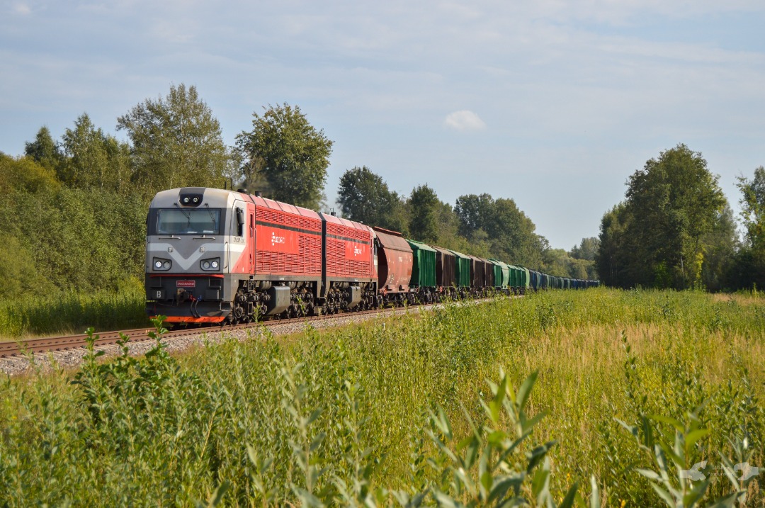 Adam L. on Train Siding: Rebuilt by Czechias CZ Loko - 2M62UM Class, numbered 0100 is seen heading towards Krustpils on the Daugavpils mainline with a loaded
string of...