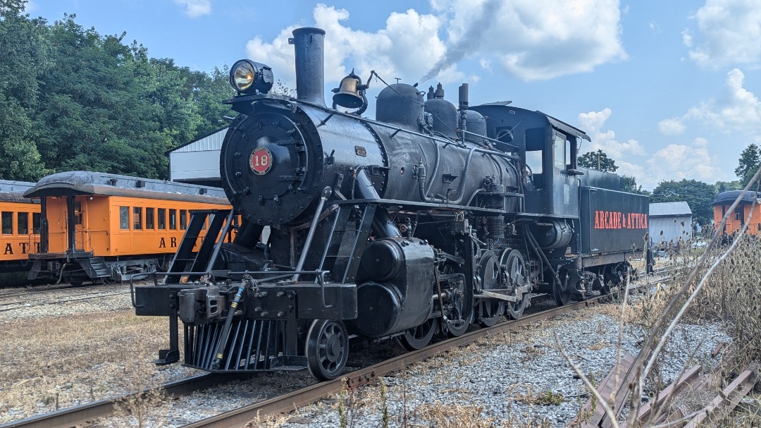 CaptnRetro on Train Siding: Arcade & Attica #18, under steam and lacking just a bit of paint and a cab number, idling out front of the Arcade shops. This
2-8-O just...