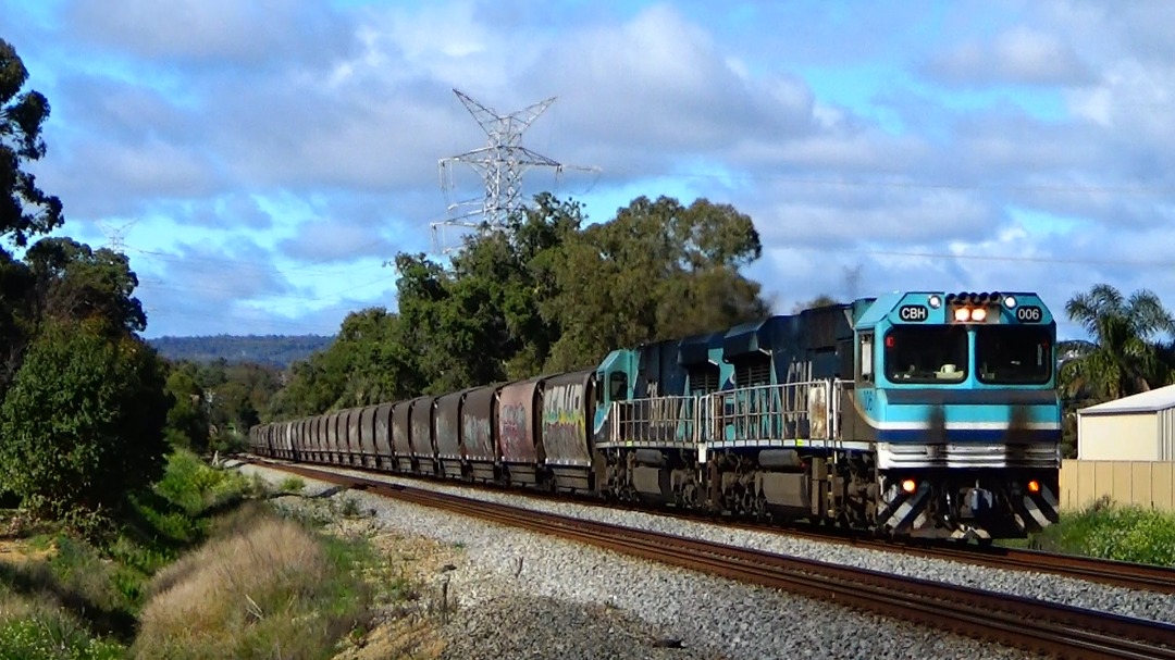 Gus Risbey on Train Siding: 1K43 CBH Kwinana Grain makes its way up the gentle grade toward the Avon Valley, sighted at Morrison rd crossing, Stratton WA on
the16/08/2023