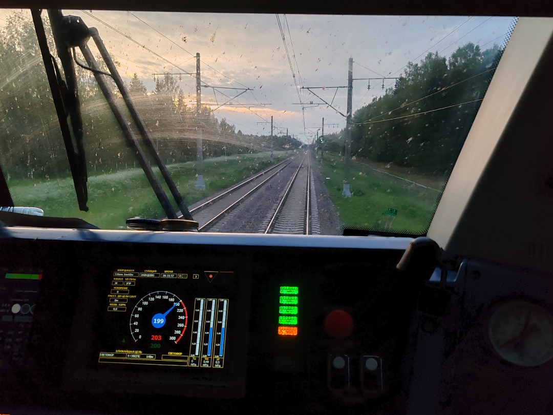 CHS200-011 on Train Siding: View from the cabin of the electric locomotive EP20-010 with high-speed train No. 748 "Nevsky Express" Moscow - St.
Petersburg. Distance...