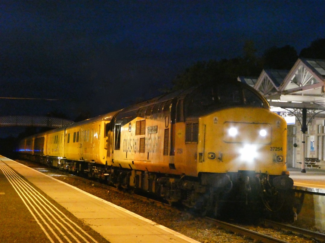 The Jamster on Train Siding: Colas Rail 37254 pauses at Dingwall for a token exchange while working 3Q36 2127 Inverness TMD to Inverness TMD via Kyle of
Lochalsh...