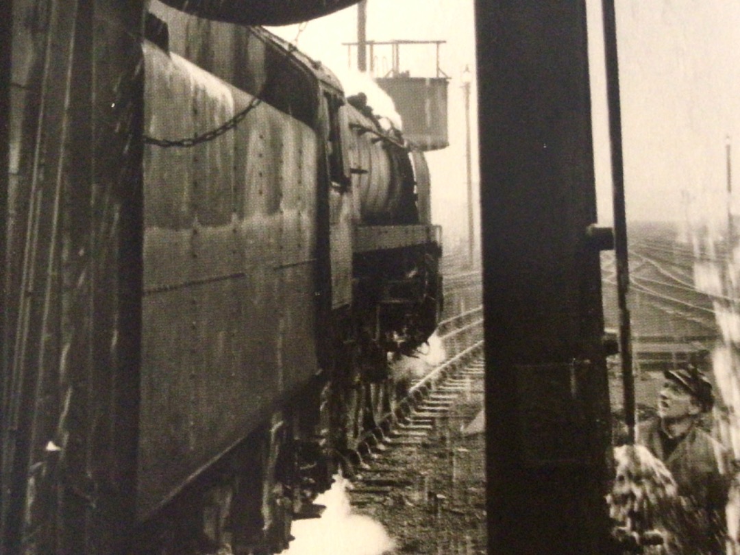 Alex Coomber on Train Siding: A wet day at Wigan. The crew of the BR Standard Class 7MT Britannia 4-6-2 No. 70027 gets a soaking while topping up with water at
the...