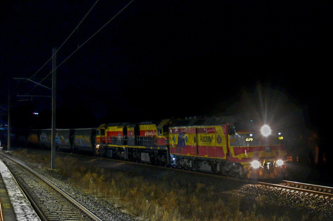 Shawn Stutsel on Train Siding: SSR's CLP9 (Auscision Models Livery), BRM001, and BRM002 trundles past Aircraft Station, Melbourne with 7994v, Loaded Grain
Service...