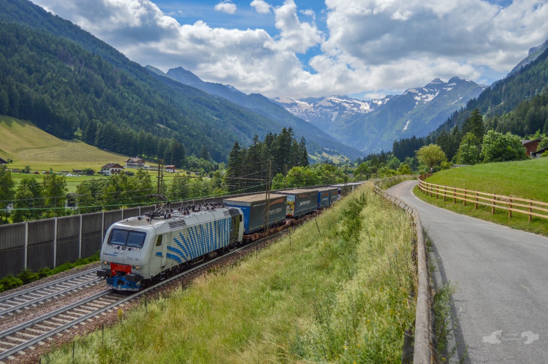 Adam L. on Train Siding: A former PKP EU43 Claas electric, running since 2003 for Lokomotions - Rail Traction Company is seen leading a heavy intermodal
train...