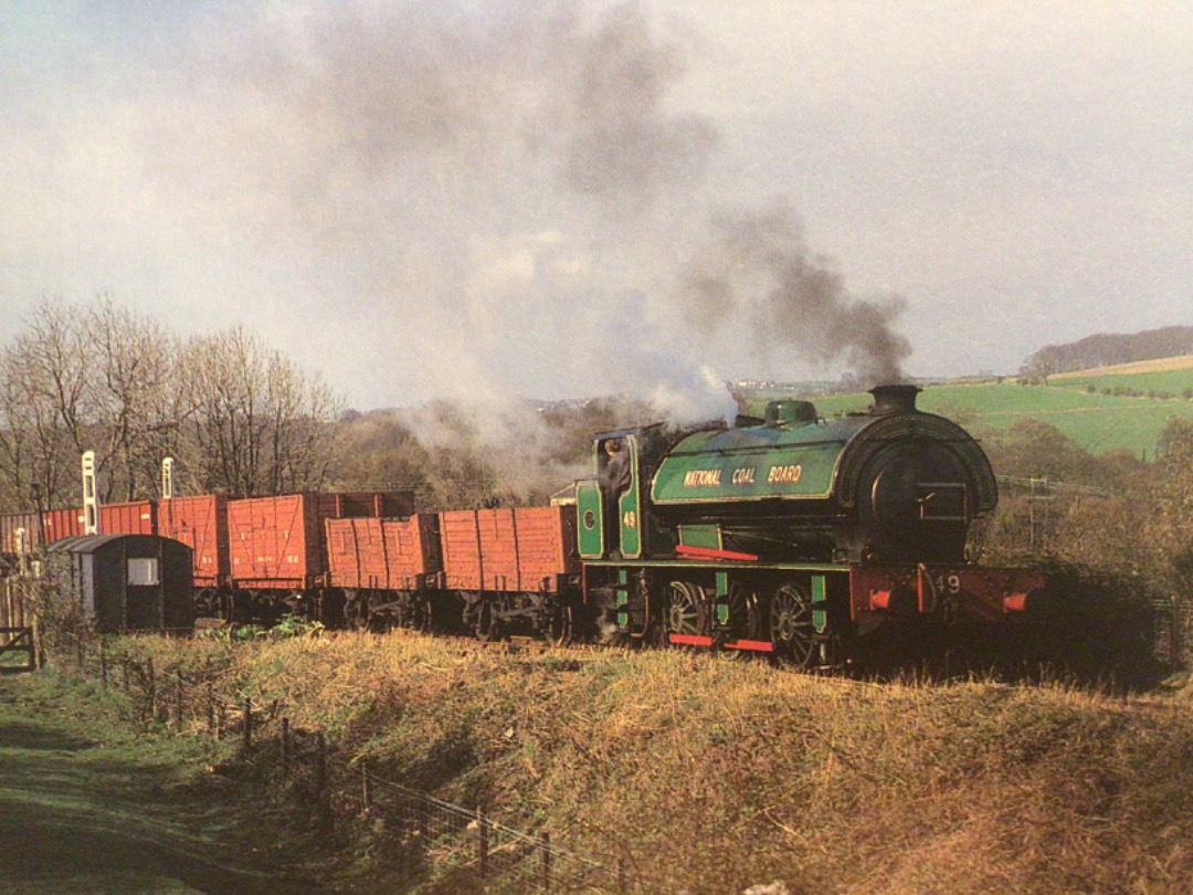 Alex Coomber on Train Siding: A National Coal Board 0-6-0 saddle tank No. 49 built by Robert Stephenson & Hawthorn in 1943 climbs through a pleasant
countryside...