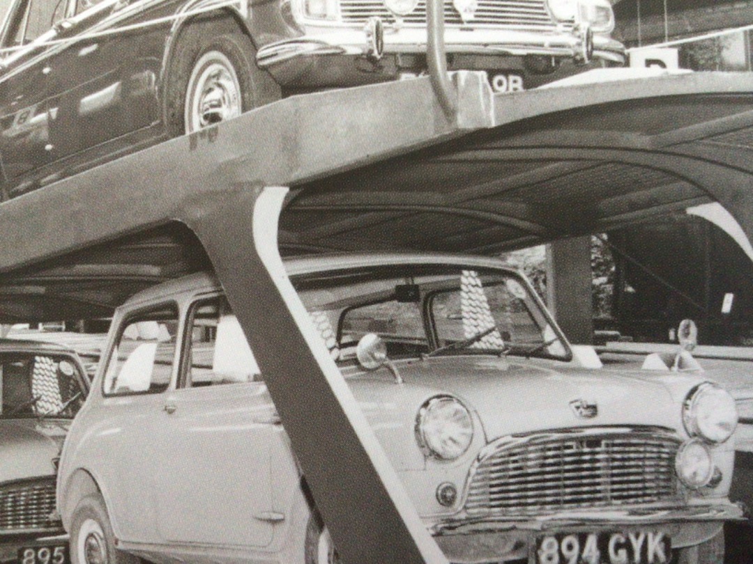 Alex Coomber on Train Siding: Cars loaded on double deck rail transporters wait to depart on a Motorail Service from Kensington Olympia on 24th May 1966.