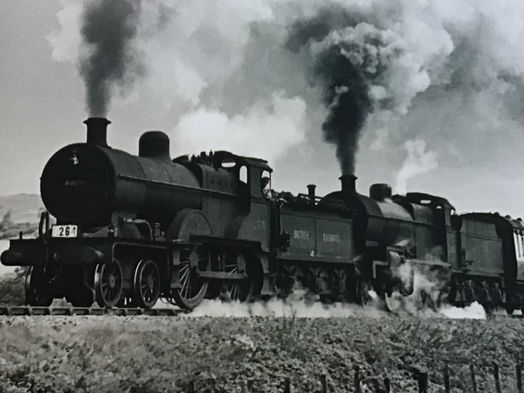 Alex Coomber on Train Siding: A double headed express blasts its way northbound near Prestleigh South of Shepton Mallet in August 1952. The leading engine is an
ex LMS...