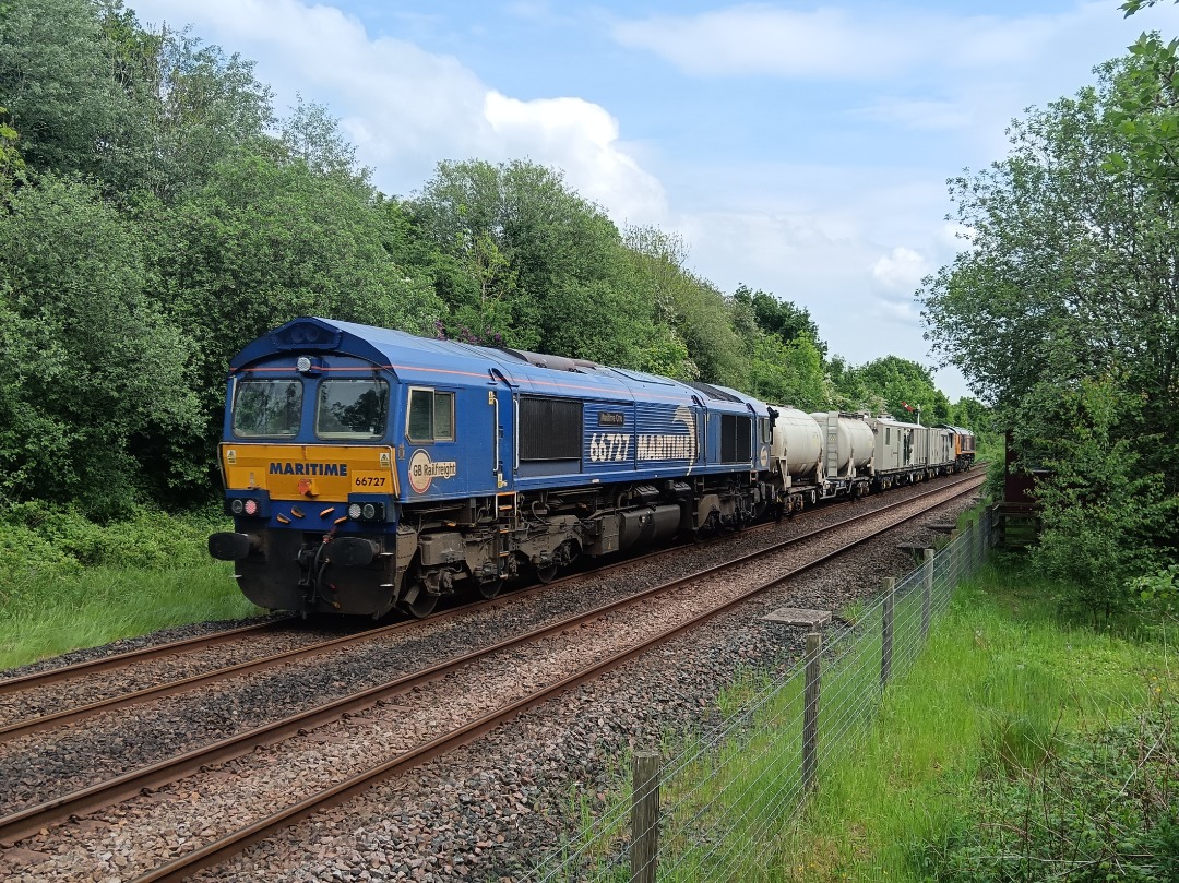 Whistlestopper on Train Siding: GB Railfreight class 66/7s No. #66761 "Wensleydale Railway Association 25 Years 1990-2015" and #66727 "Maritime
One" passing Appleby...